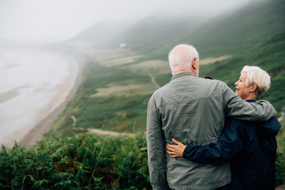 happy-senior-couple-enjoying-breathtaking-view-1